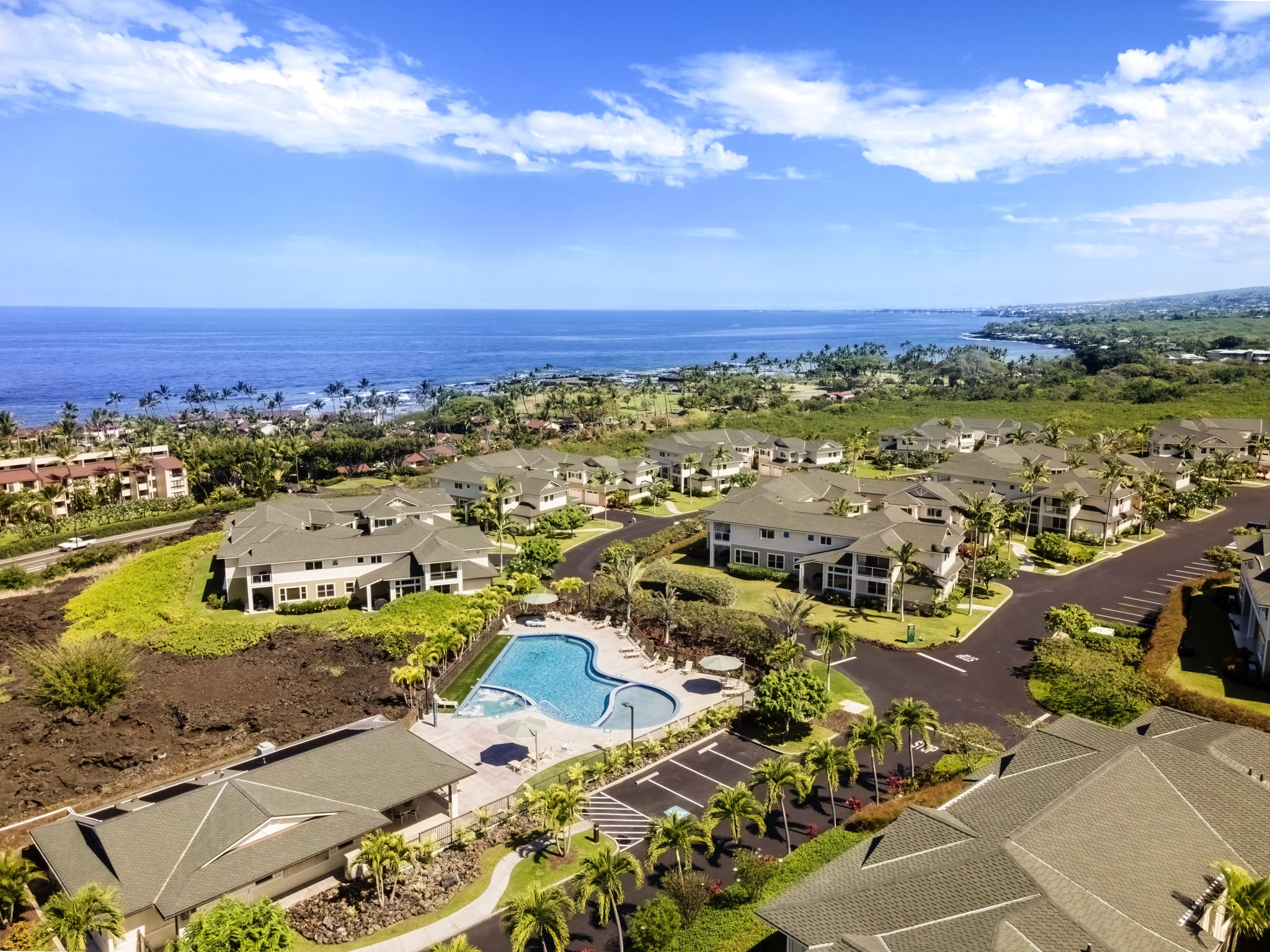 an aerial view of residential houses with outdoor space