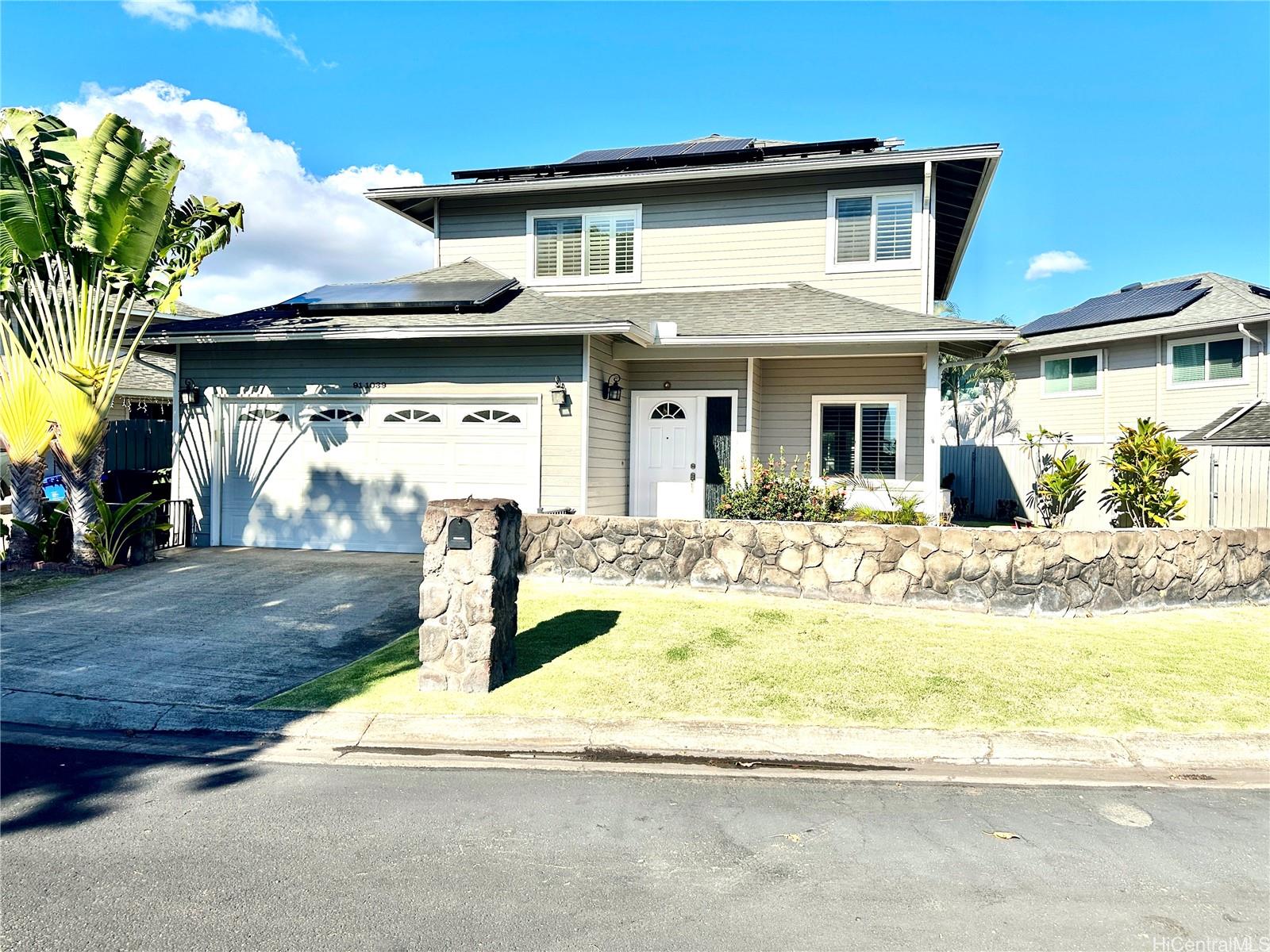 a front view of a house with swimming pool