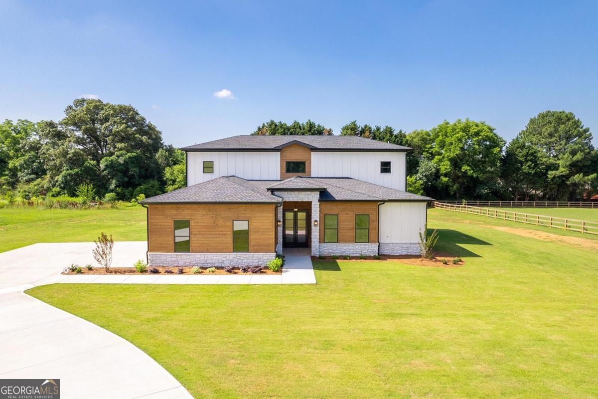 a front view of a house with swimming pool