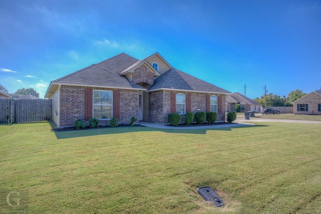 a front view of a house with a yard