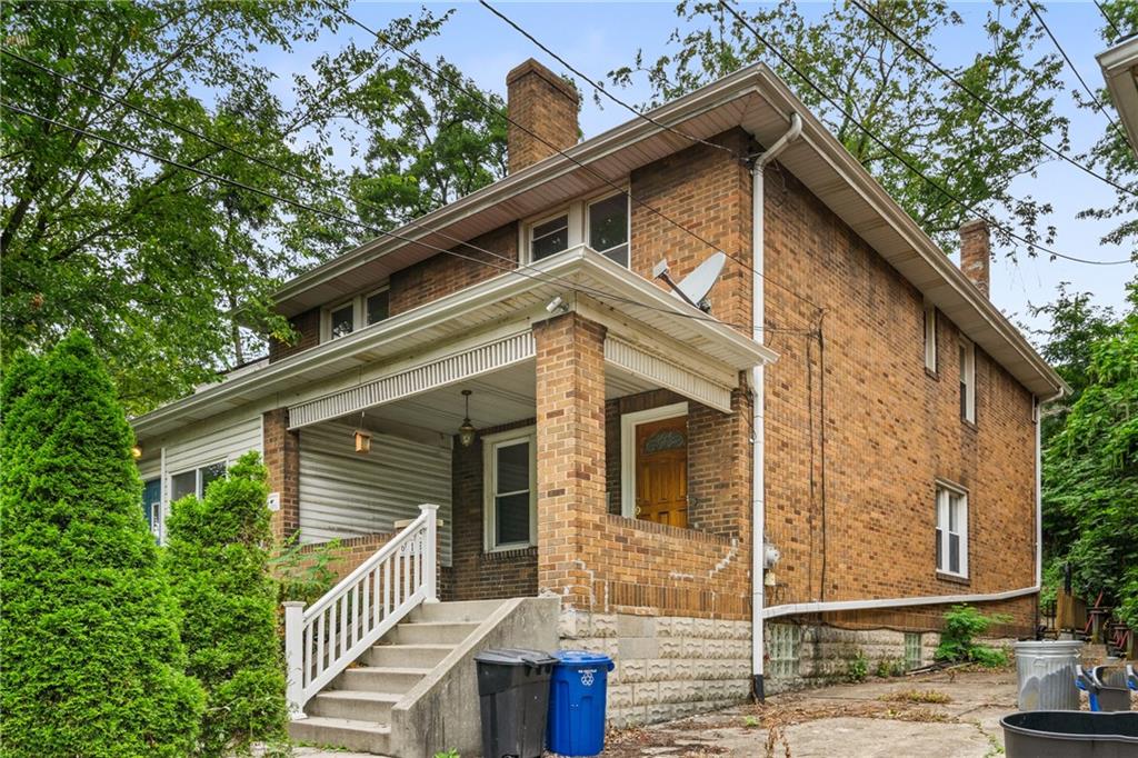 a front view of a house with garage