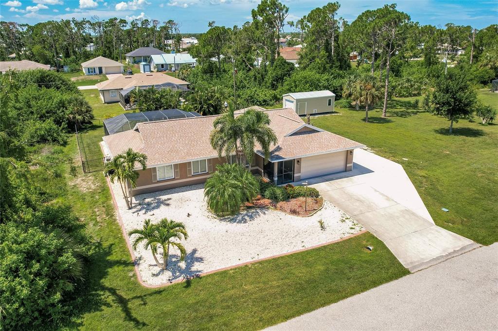 a aerial view of a house with a yard