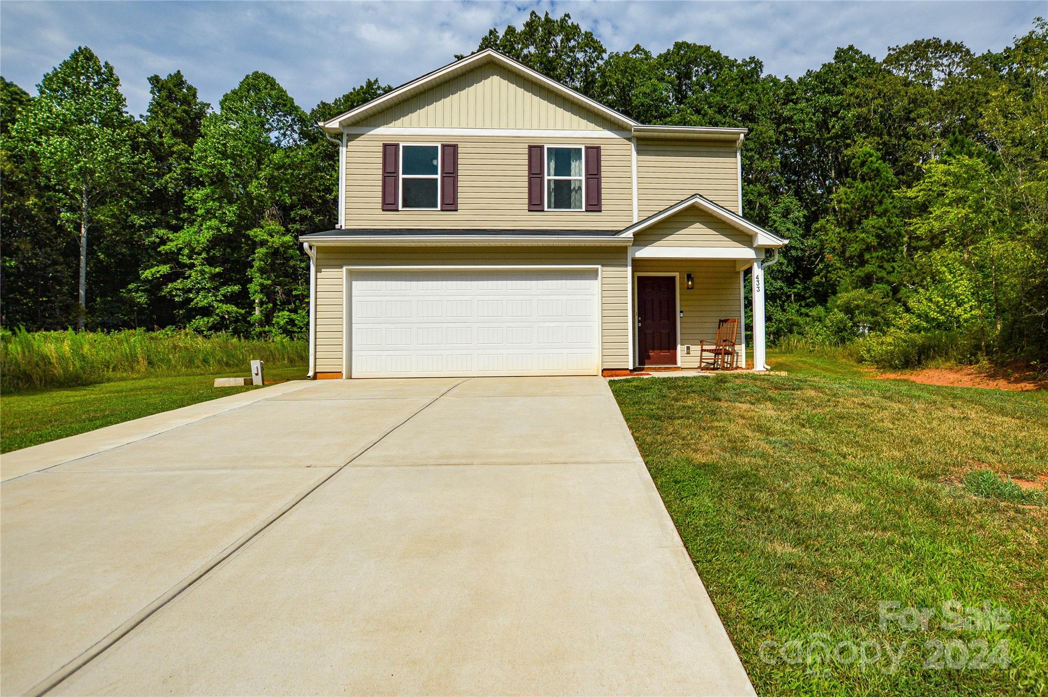 a front view of a house with yard