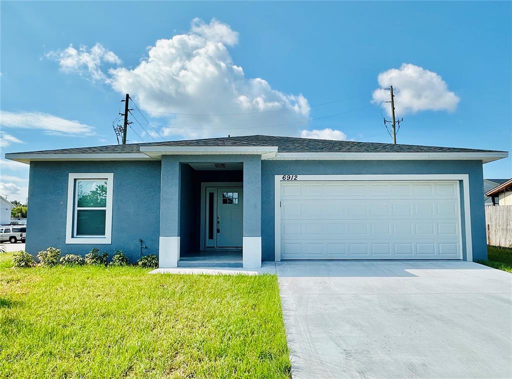 a view of a house with a yard