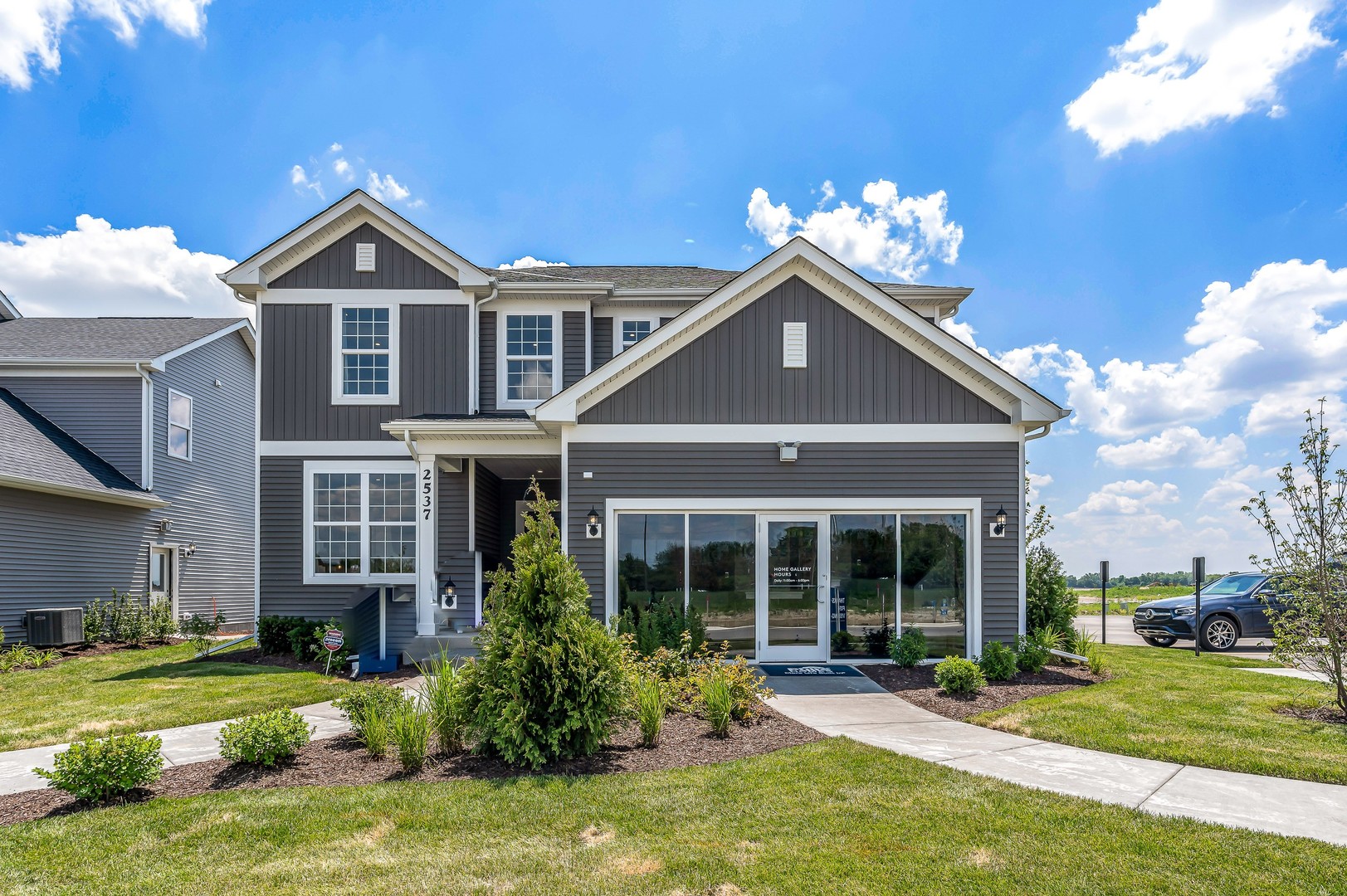 a front view of a house with a yard