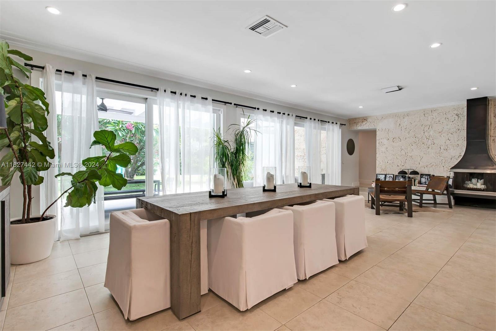 a kitchen with stainless steel appliances a sink and a large window