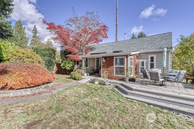 a house view with a sitting space and garden space