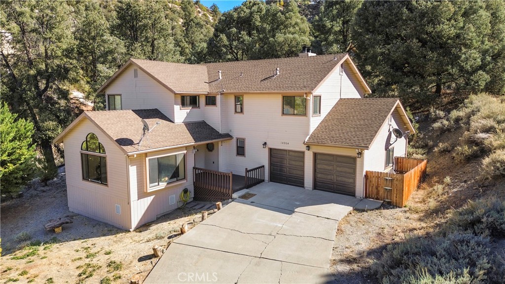 a aerial view of a house with a yard