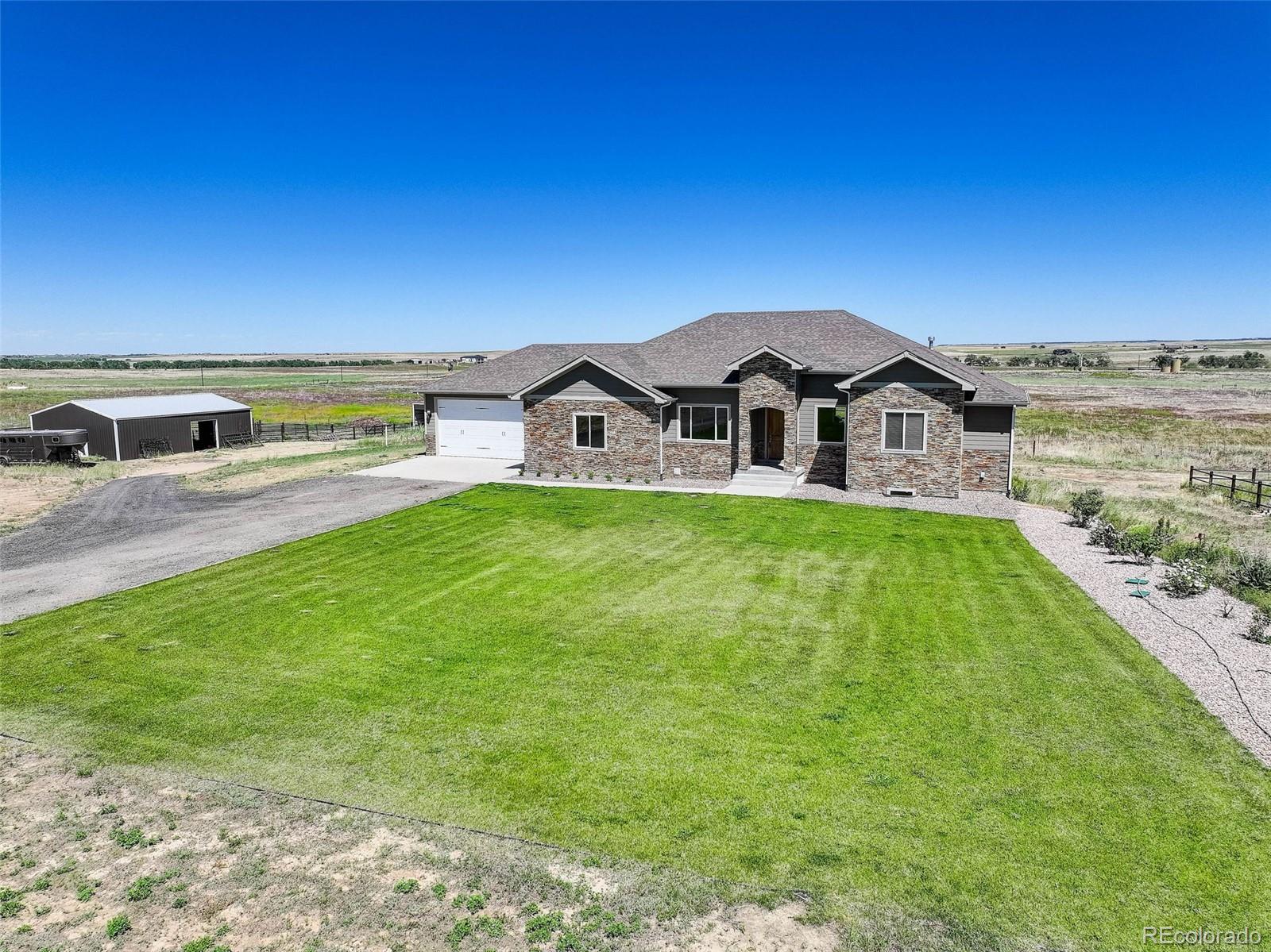 a view of a house with a big yard