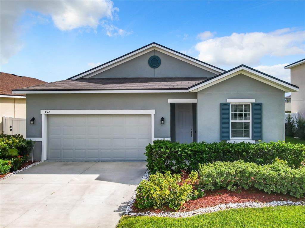 front view of a house with a yard