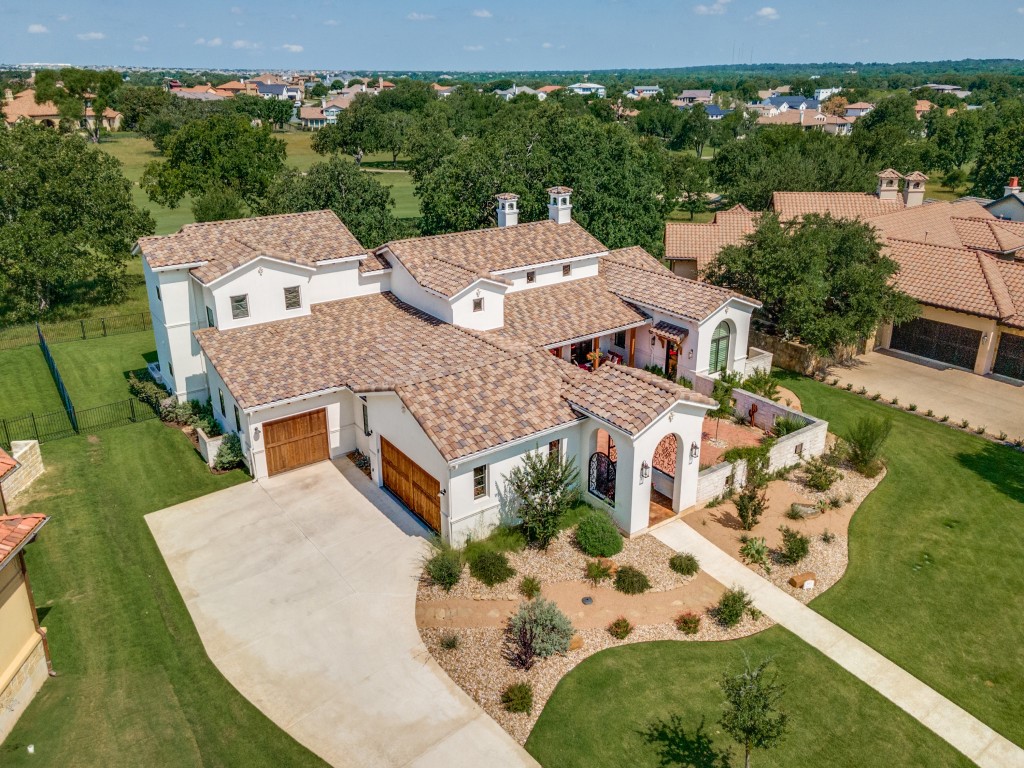 an aerial view of a house with a garden