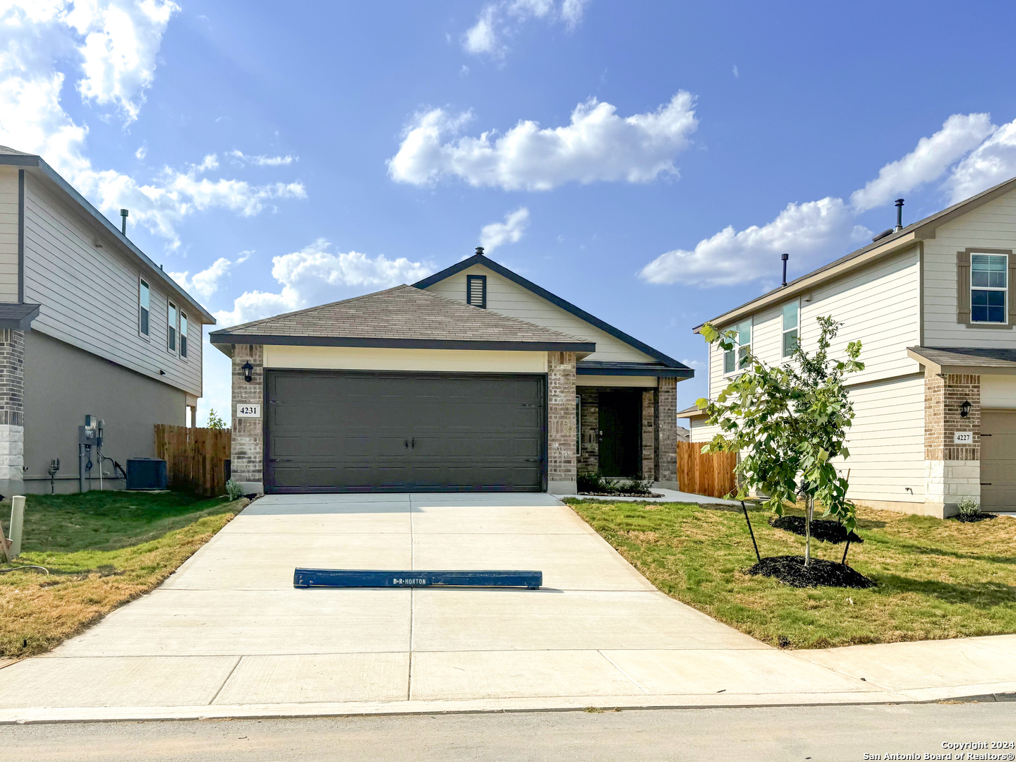 a house view with a garden space