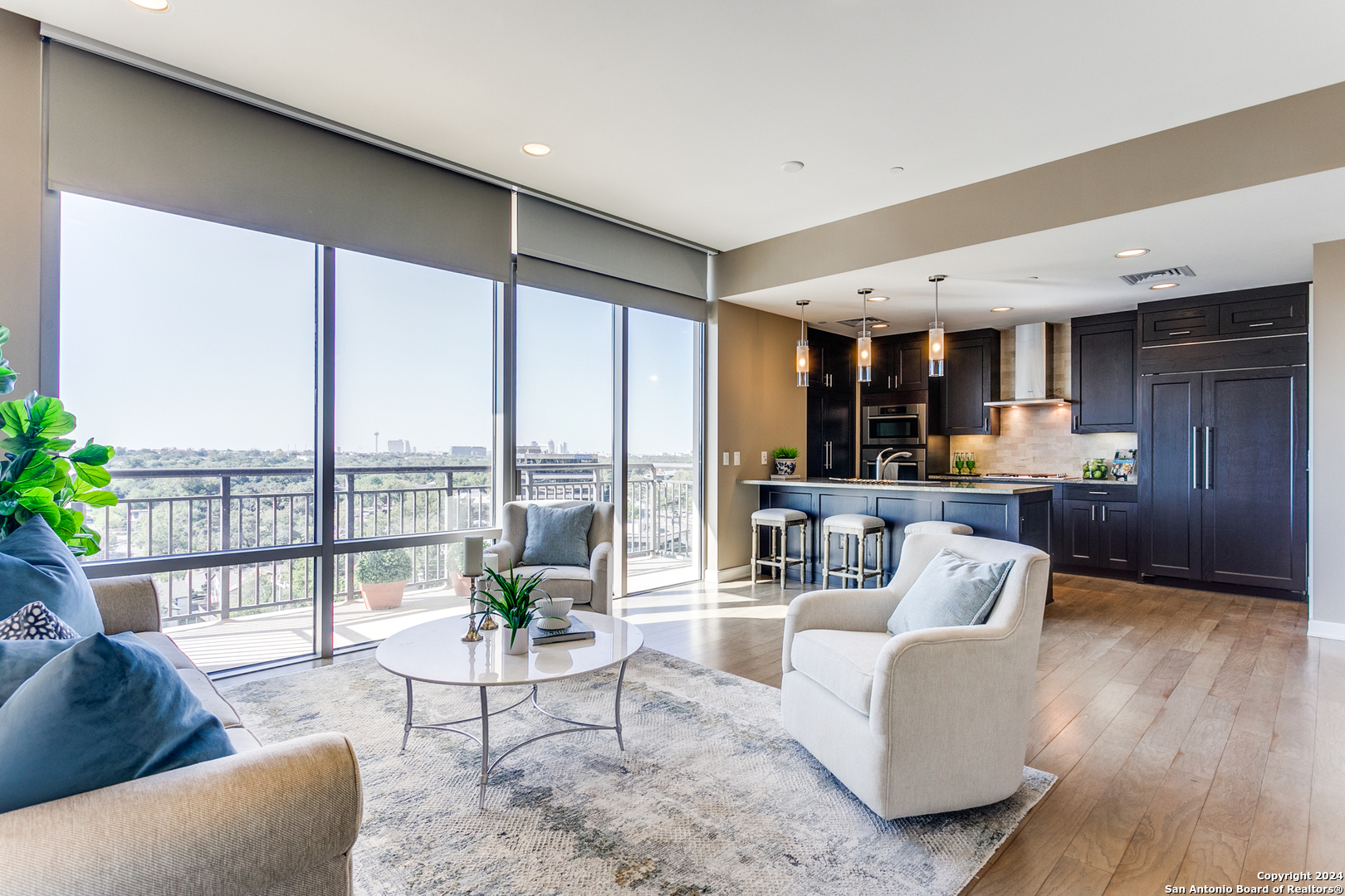 a living room with furniture and a large window