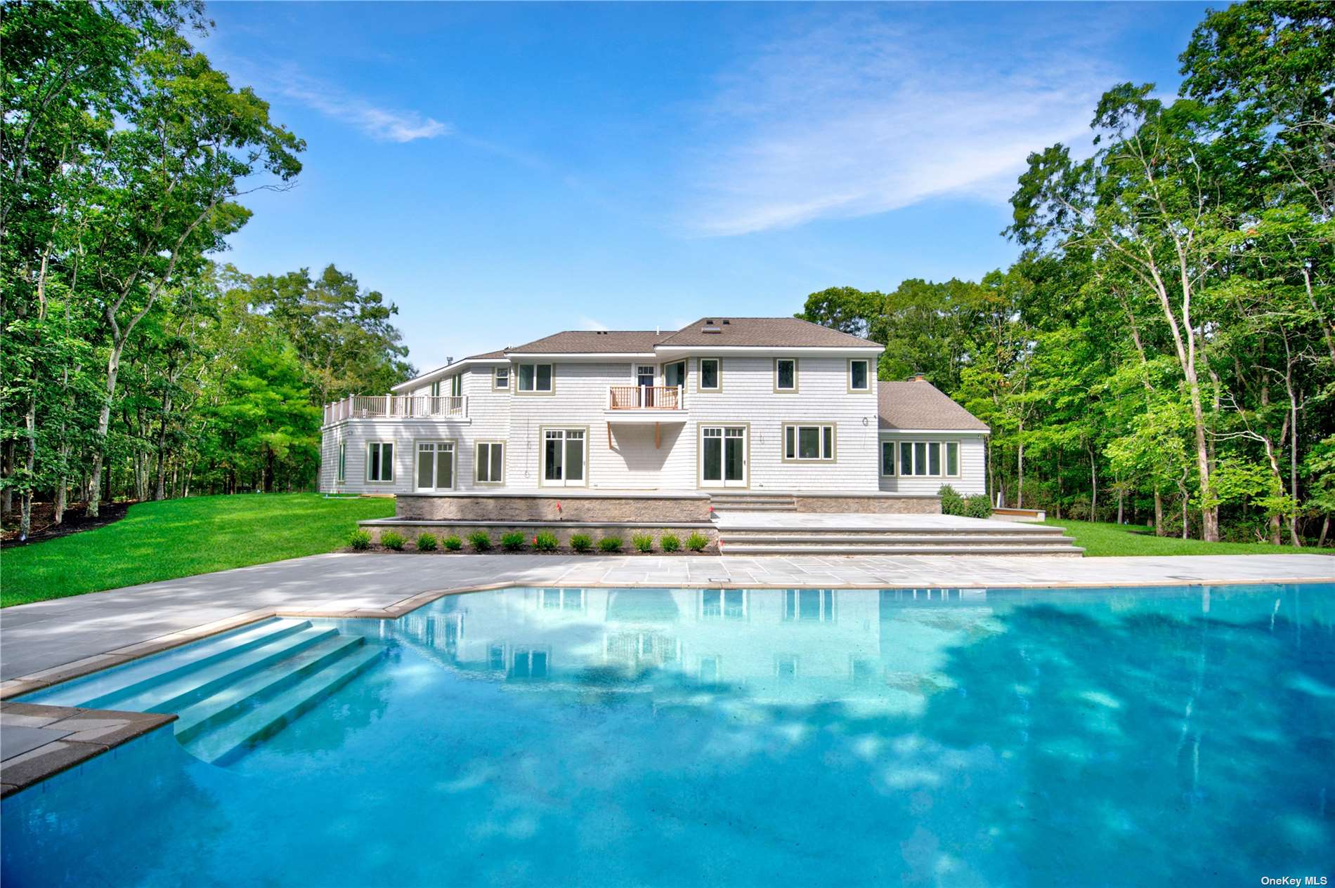 a view of house with backyard and garden