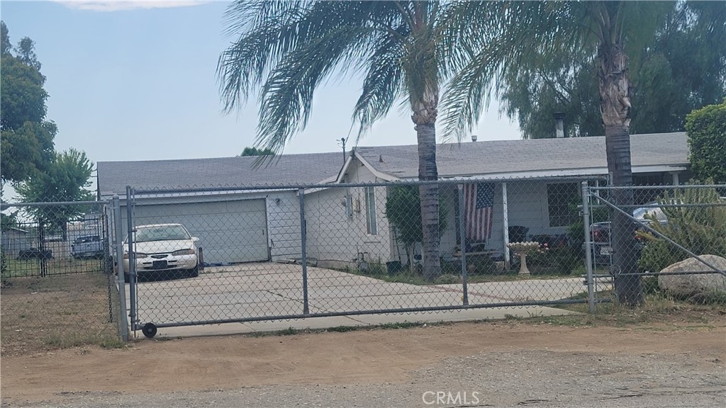 a white house with tree in front of it