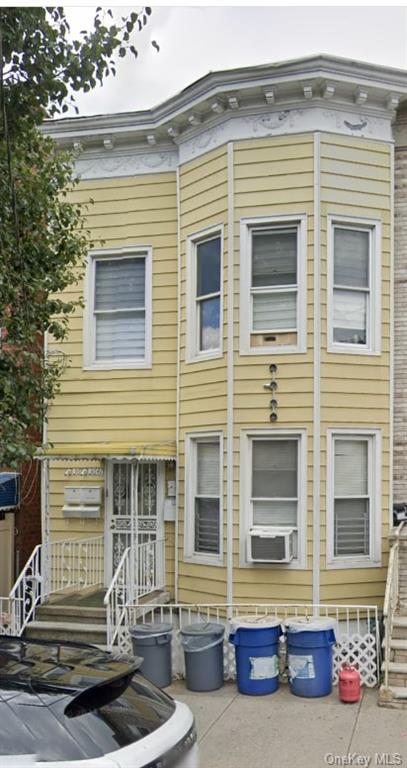 View of front of house featuring cooling unit