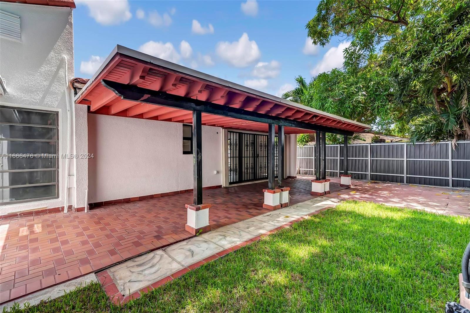 a front view of house with yard and outdoor seating