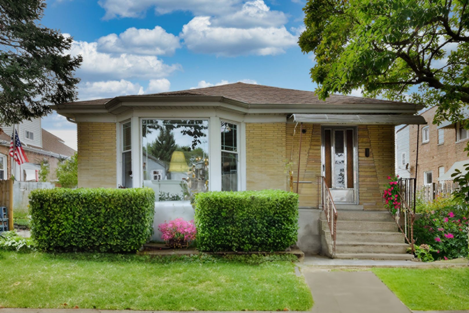 a front view of a house with garden