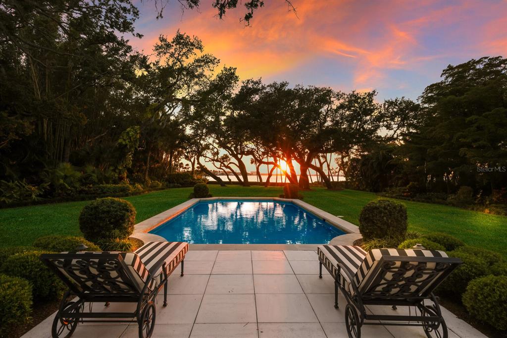 a backyard of a house with outdoor seating