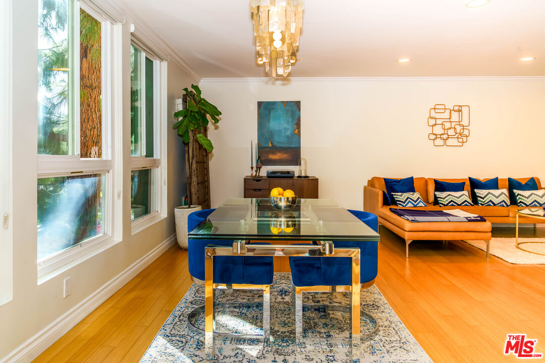 a dining room with a table and chairs