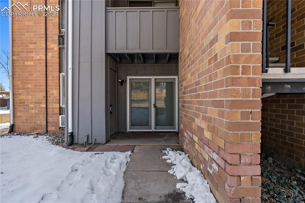 a view of a brick house with a door