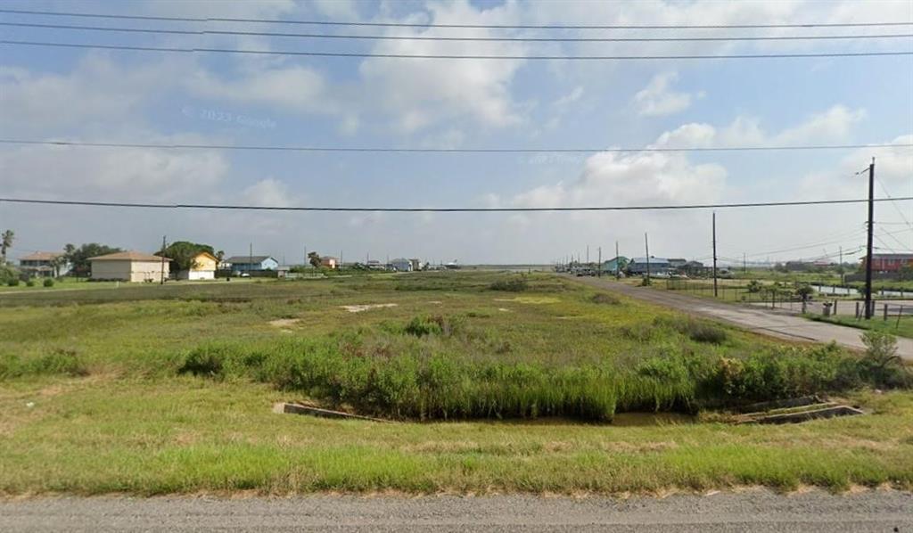 a view of a pool of a house with a yard