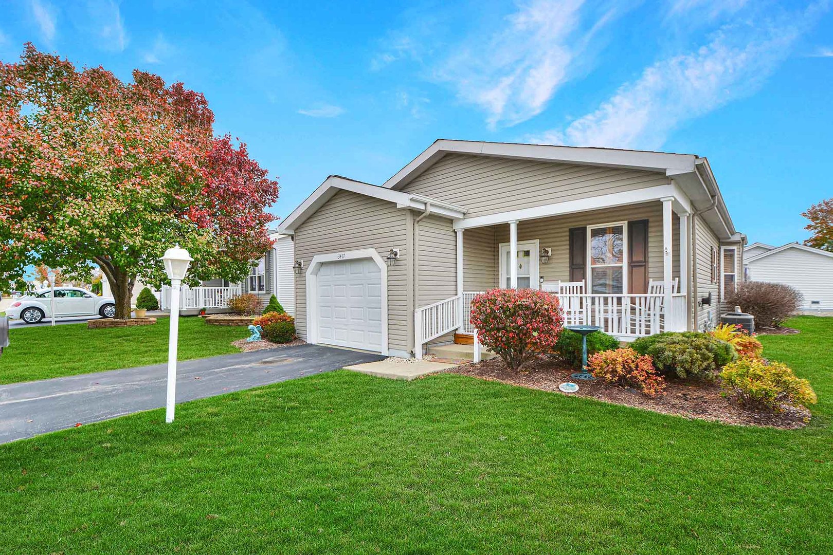 a view of a house with a yard and plants