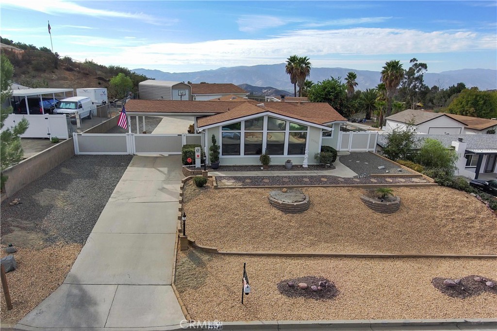 an aerial view of a house with swimming pool