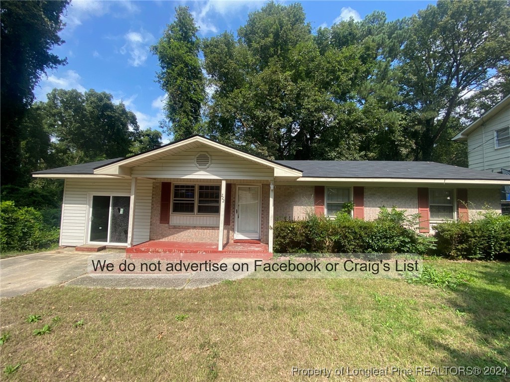 front view of a house with a yard