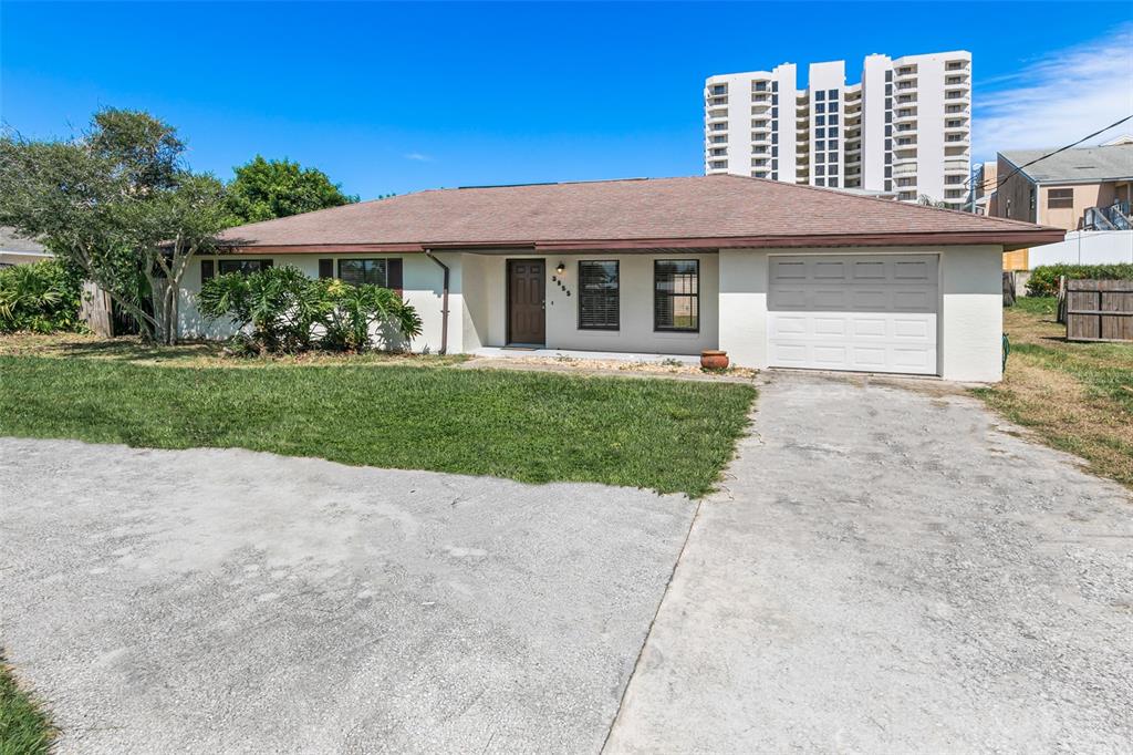 front view of a house with a yard