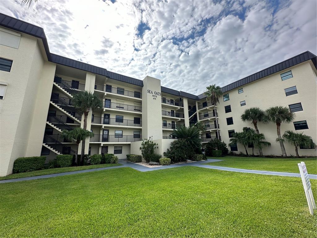 a front view of building with yard