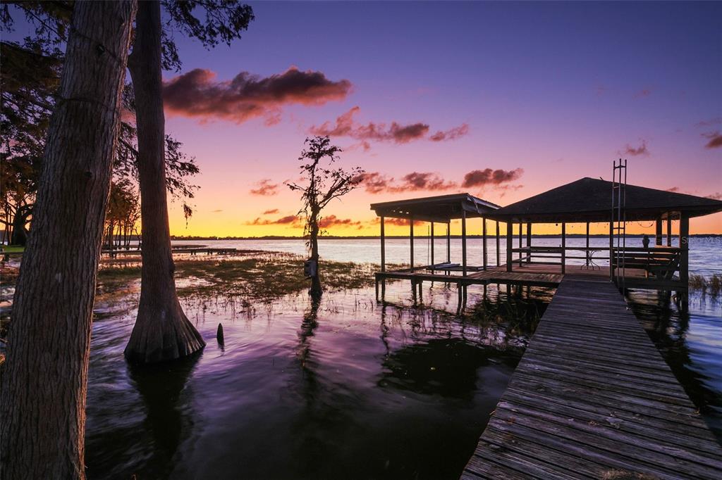 Dock and boat lift at sunset