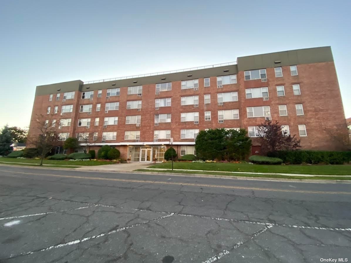 a view of a big building and a big yard