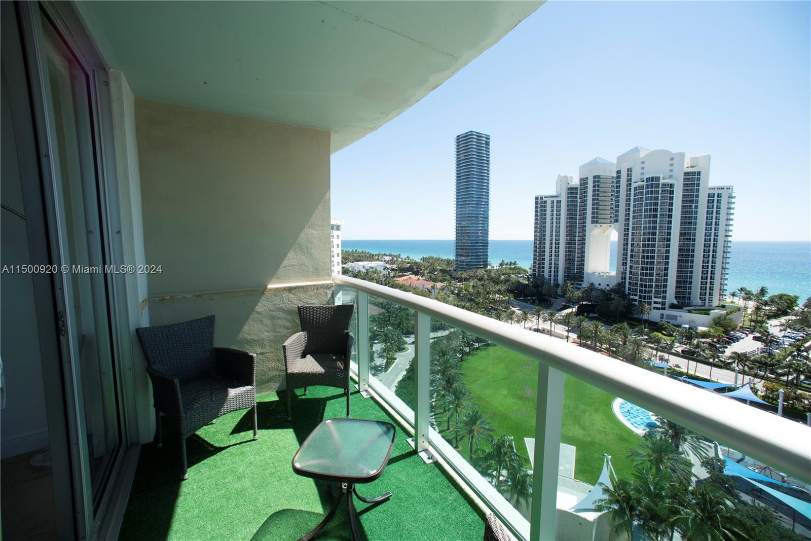 a balcony with tall trees