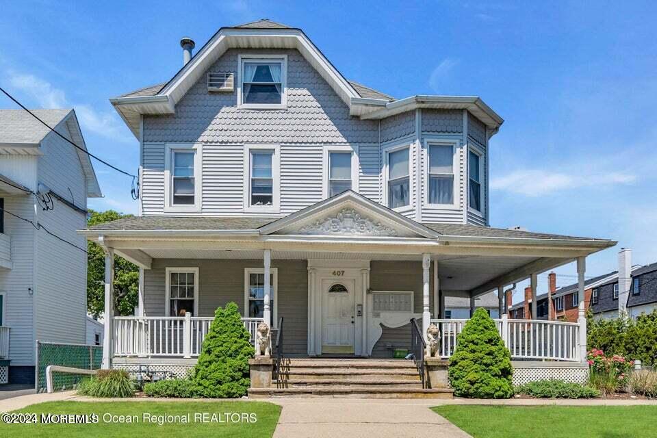 front view of a house with a yard