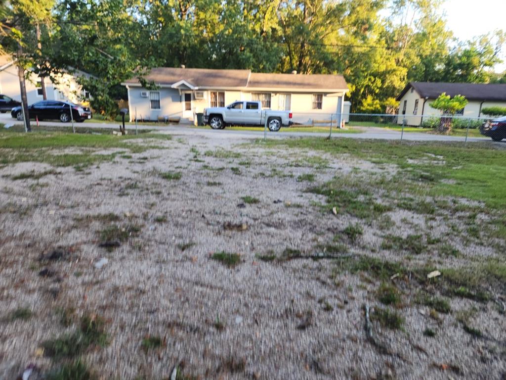 a front view of a house with a yard table and chairs