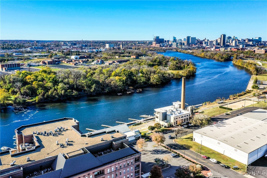 Birds eye view of property featuring a water view