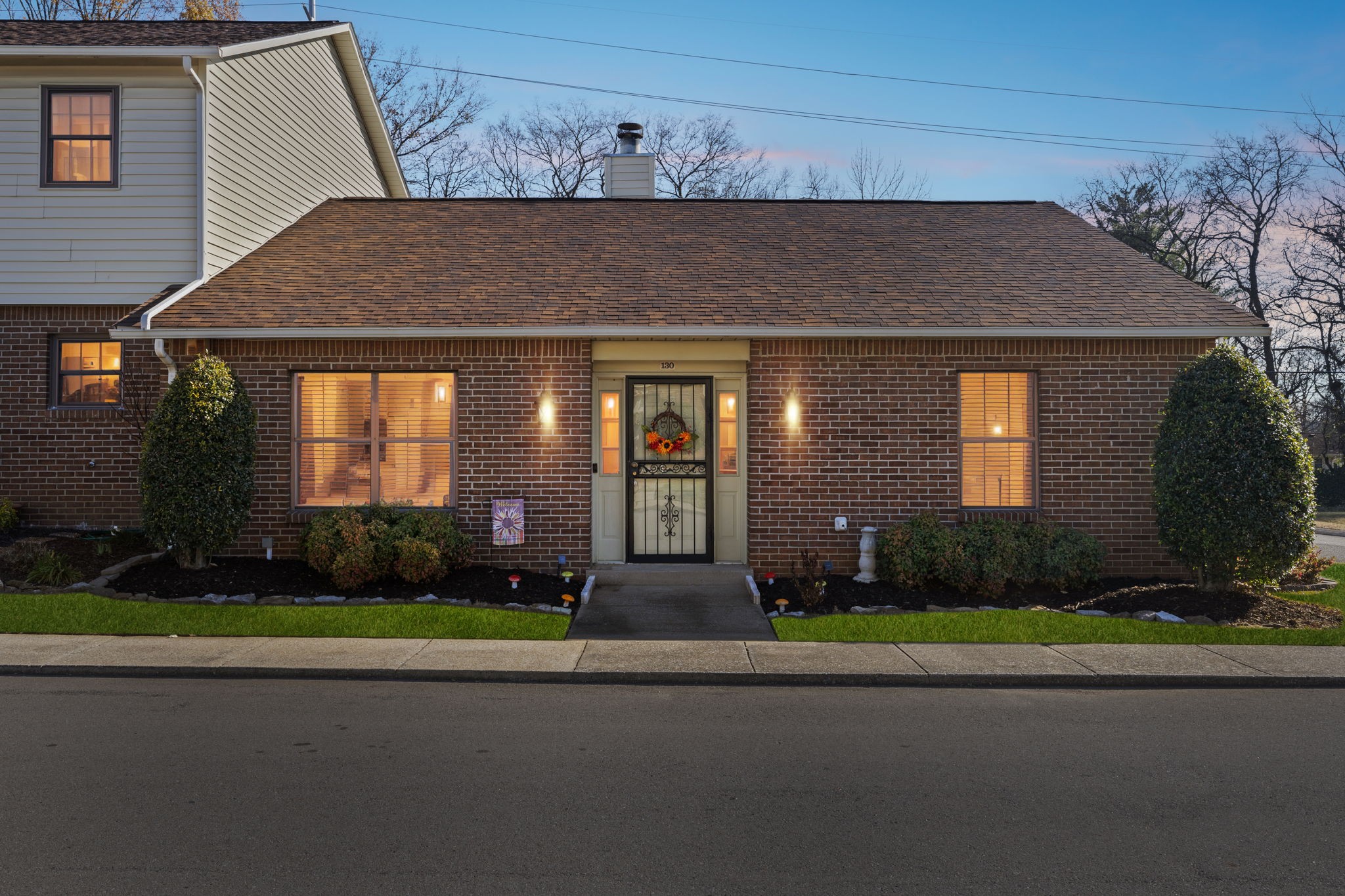 a front view of a house with garden