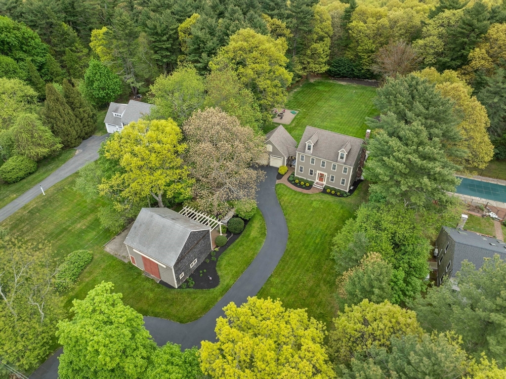 an aerial view of a house with outdoor space