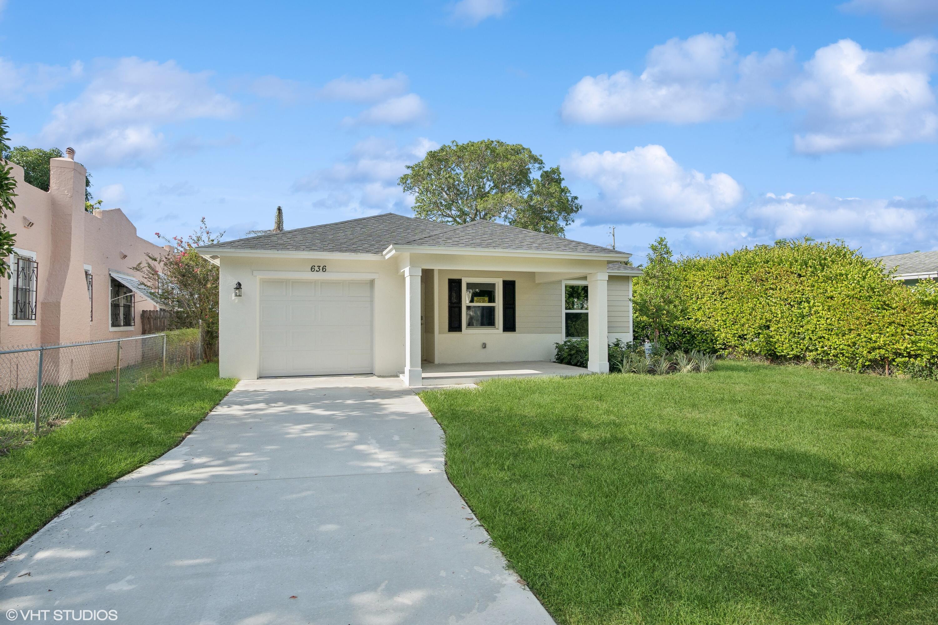 front view of a house with a yard