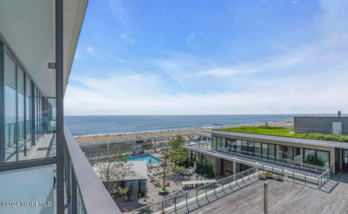 a view of a balcony with an ocean view