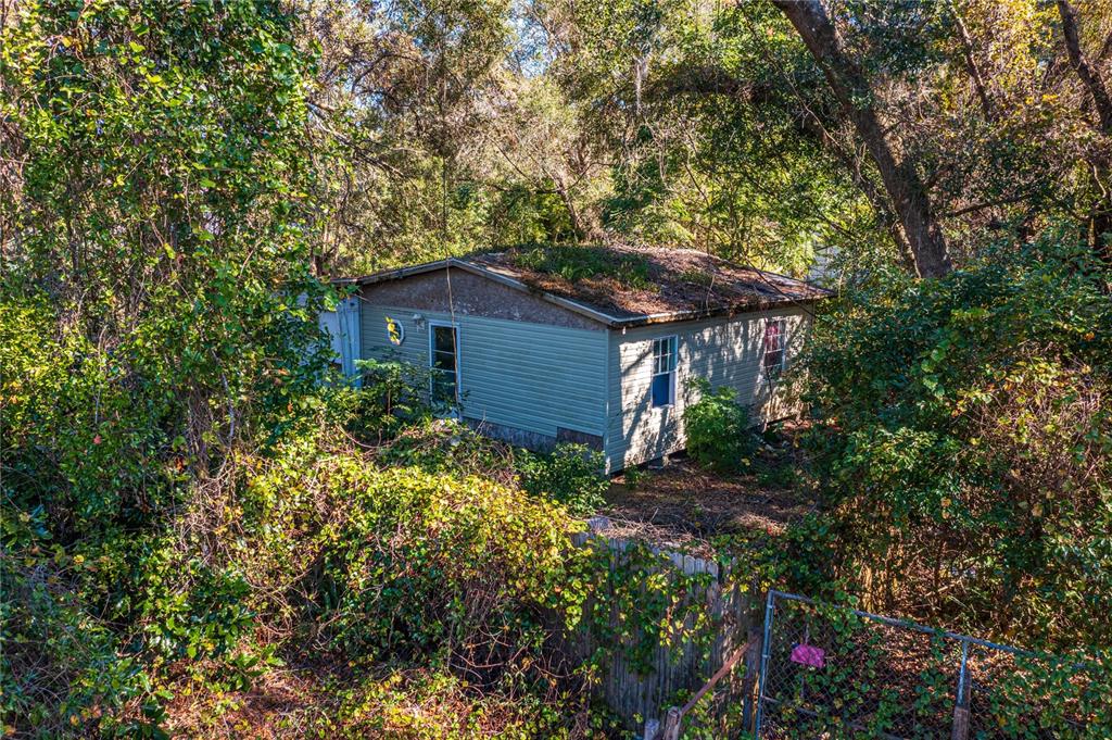 a view of a house with a tree