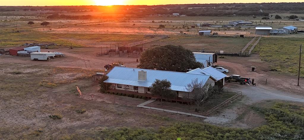 an aerial view of a house with outdoor space