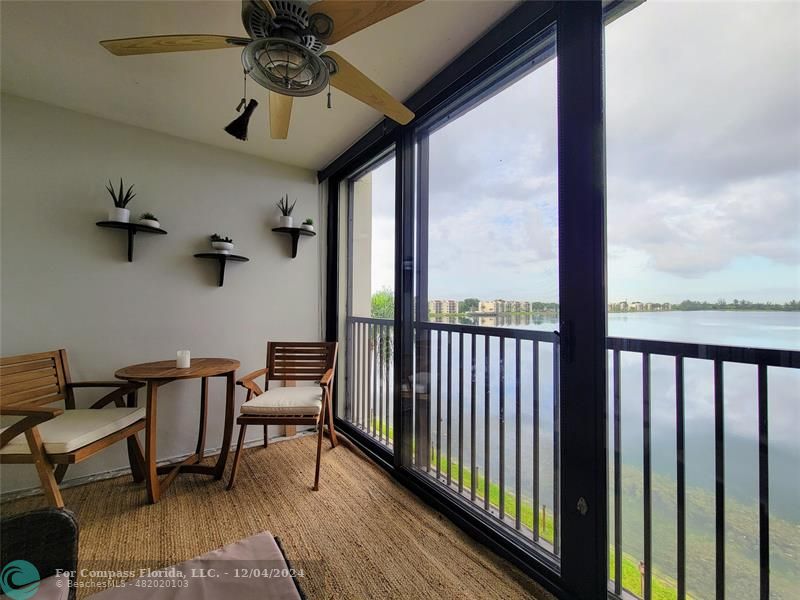 a view of a balcony with furniture