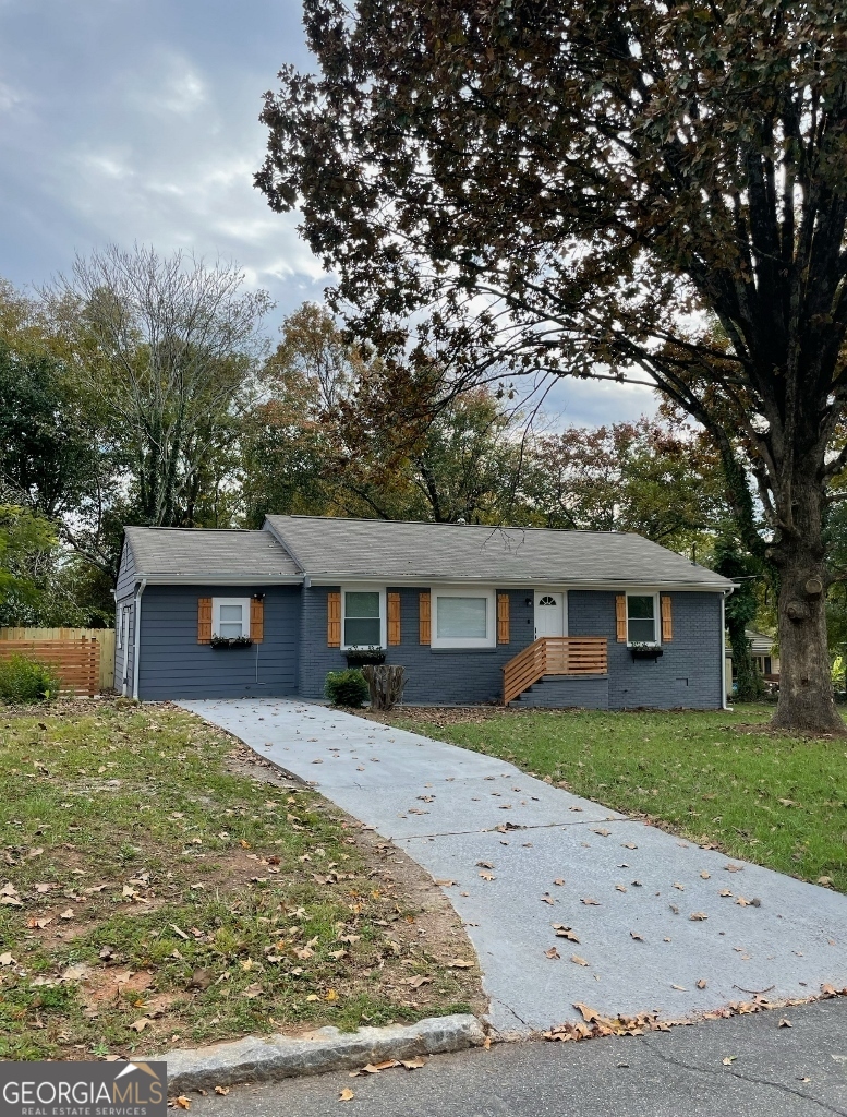 front view of a house with a yard