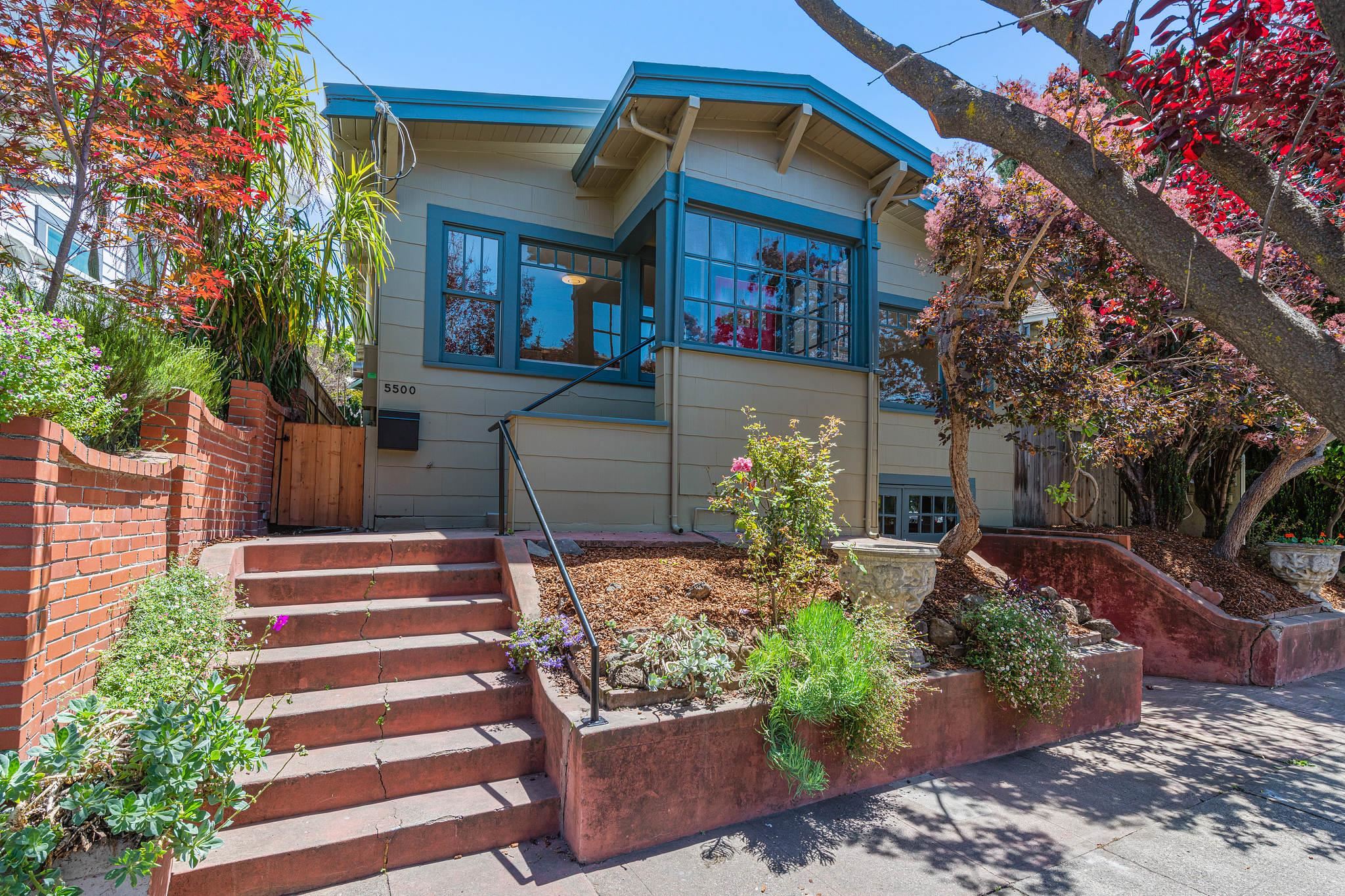 a front view of a house with garden