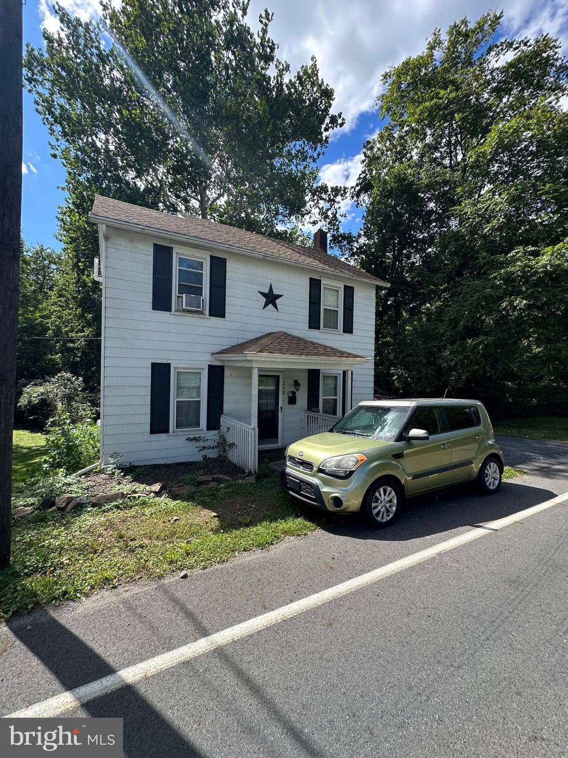 a view of a car parked in front of a house