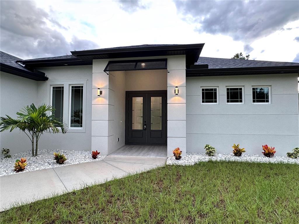 a front view of a house with a yard