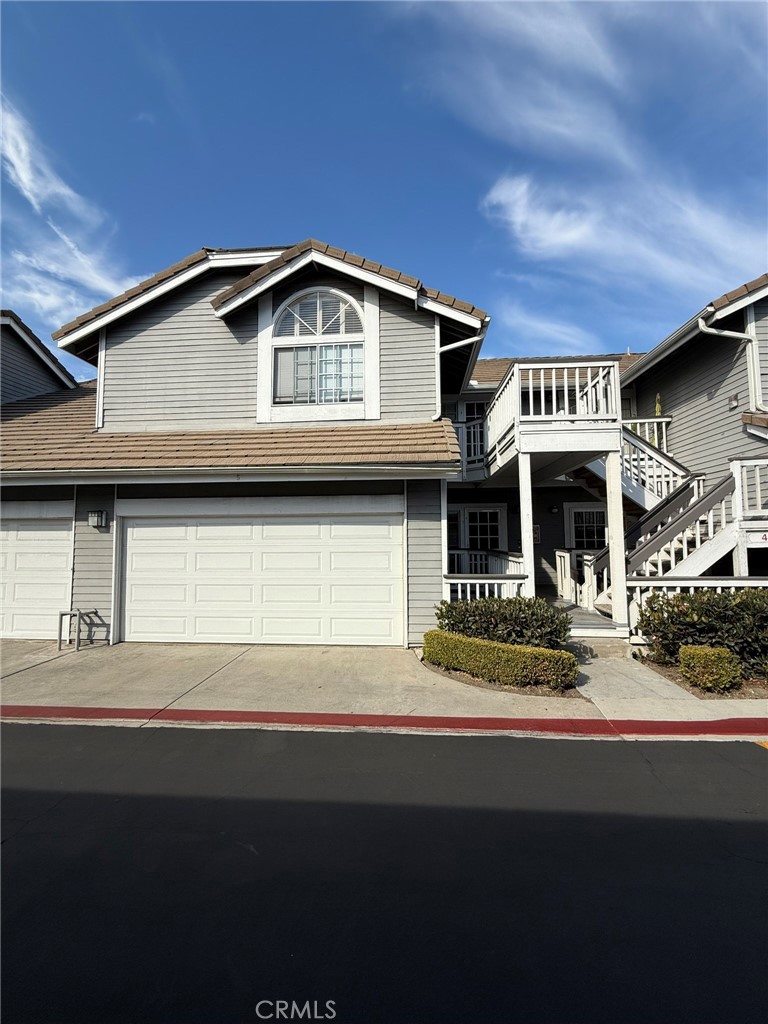 a front view of a house with garage