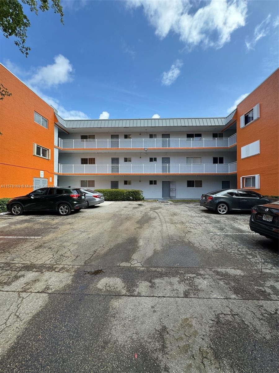 a view of parking with cars parked